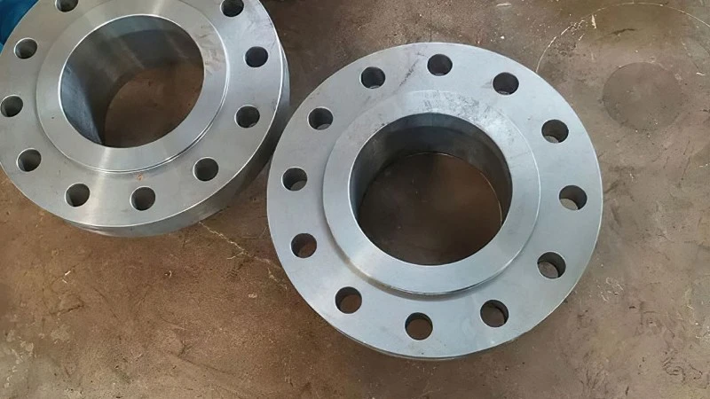 Integral welded flange